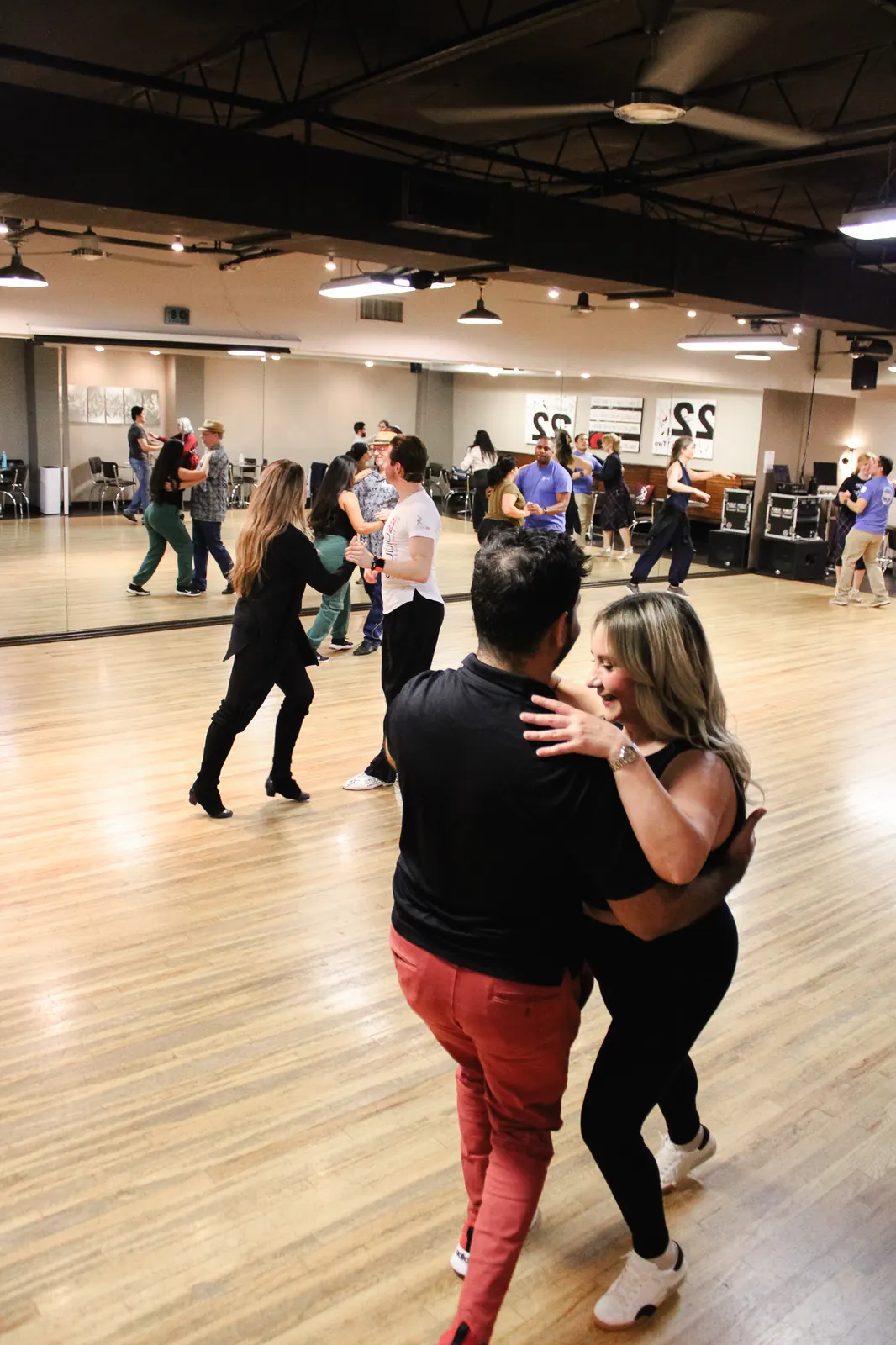 Students practicing salsa in a group class